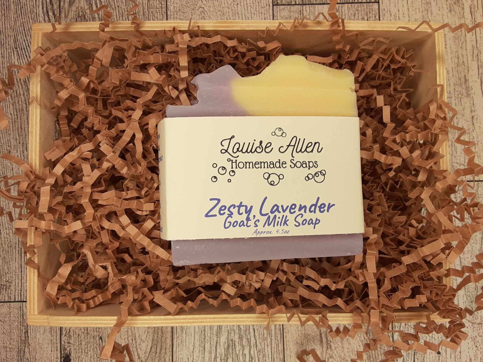 Bar of soap with 'Louise Allen Homemade Soaps' branding on crinkled paper