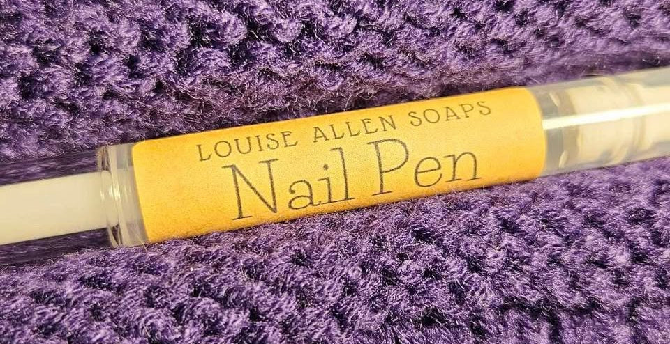 Louise Allen Soaps nail pen on a purple textured surface