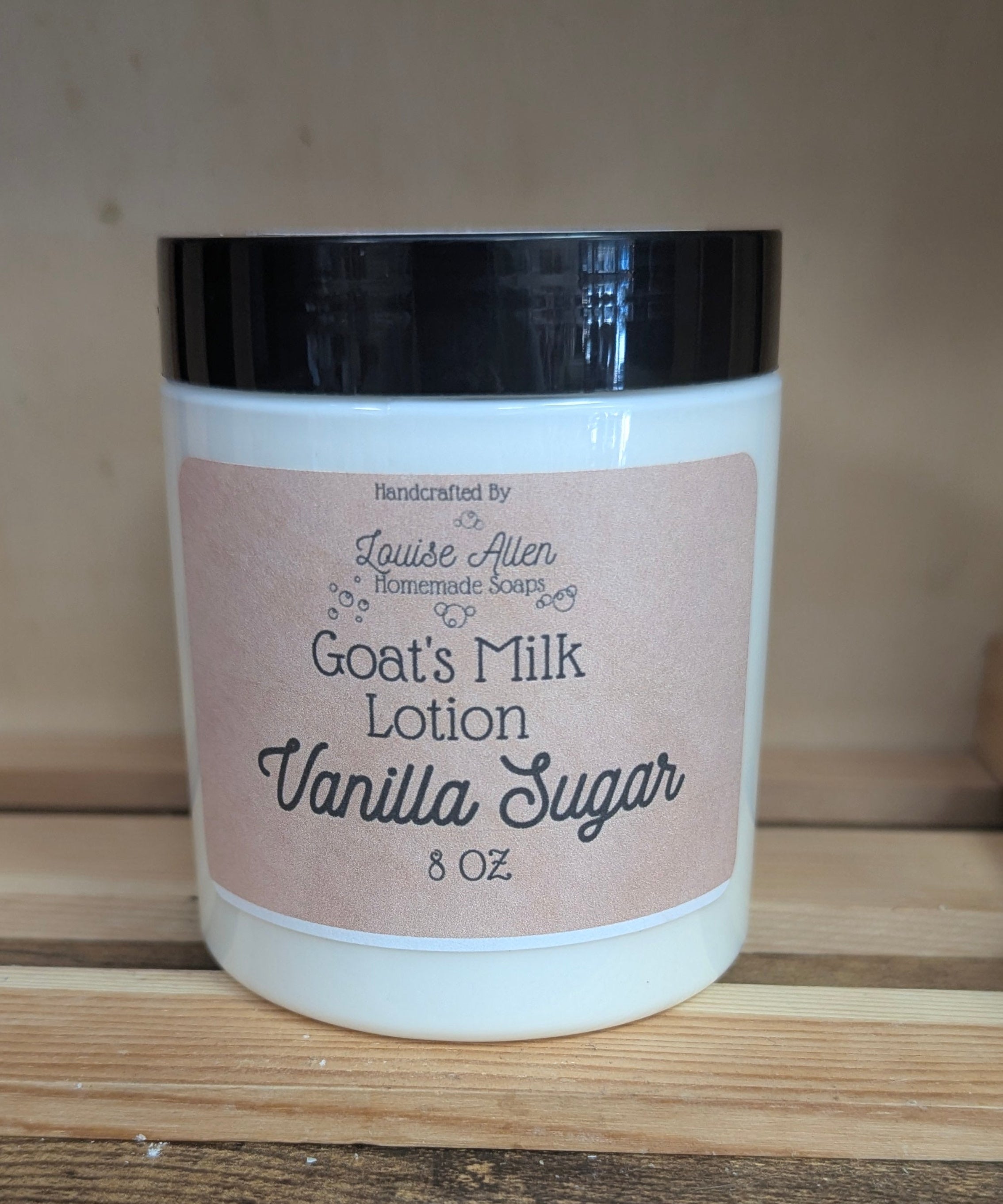 Jar of Vanilla Sugar lotion on a wooden surface