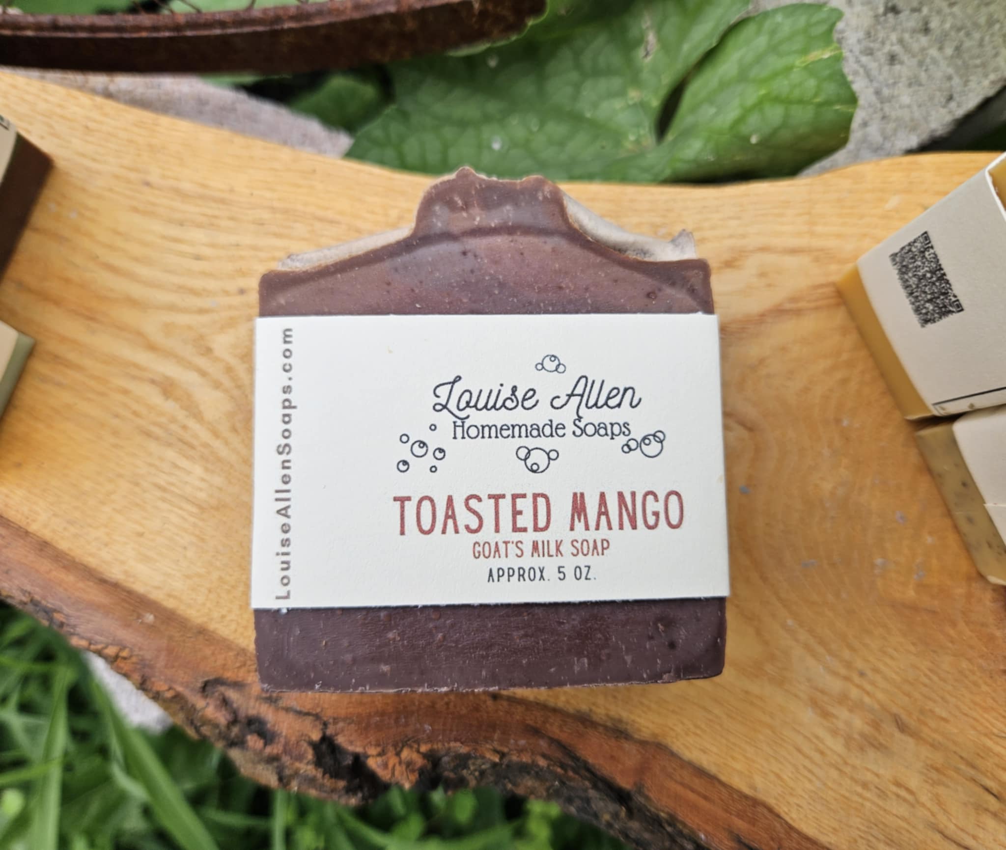 Bar of soap with a label on a wooden surface