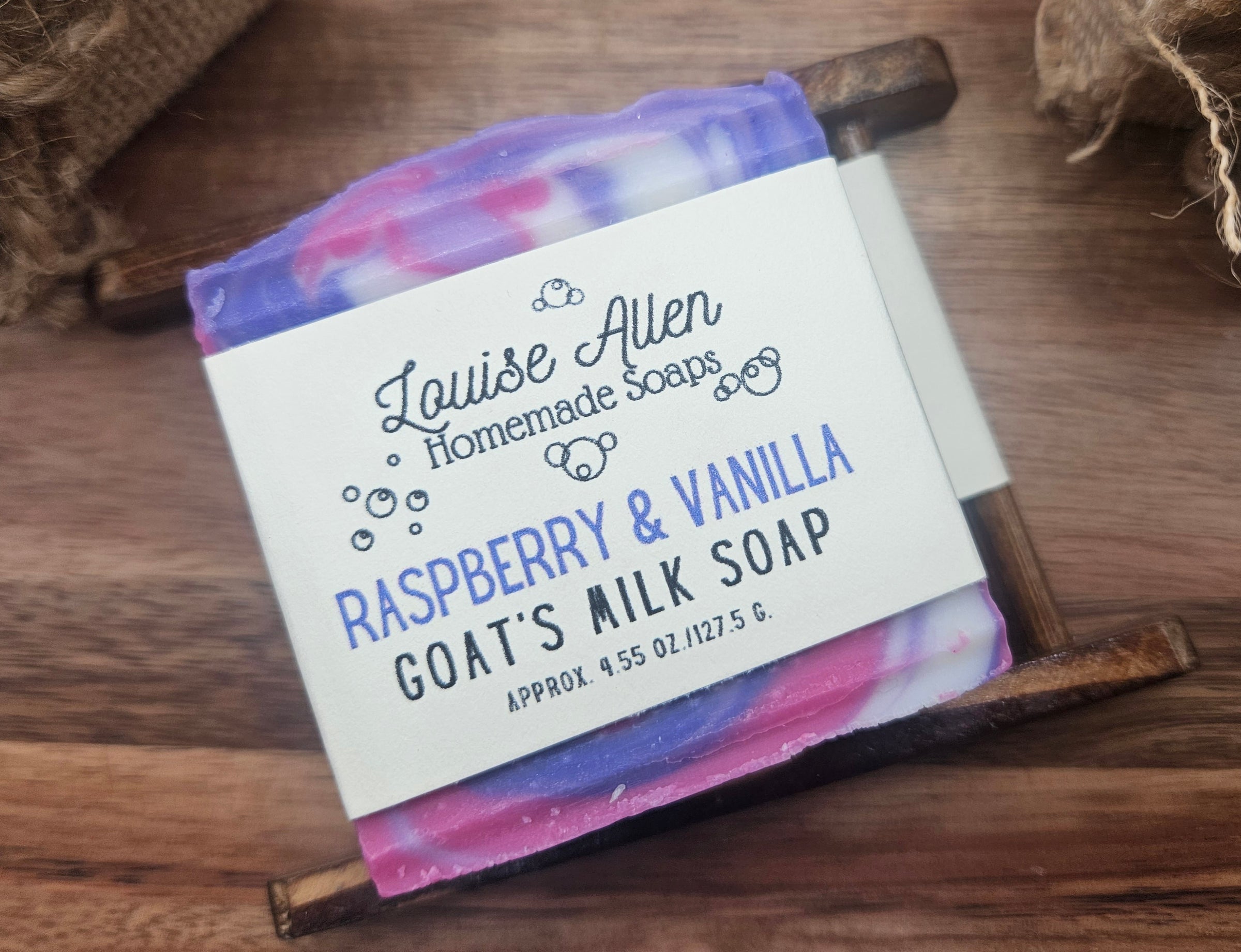 Bar of soap with a label on a wooden surface